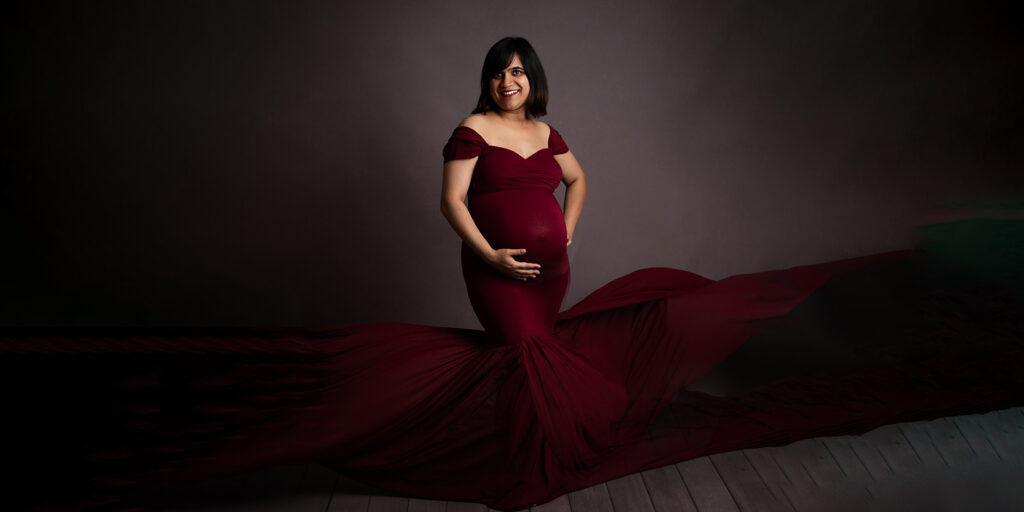 pregnant mama in red dress by Maternity and newborn photographer olney, milton keynes, northampton