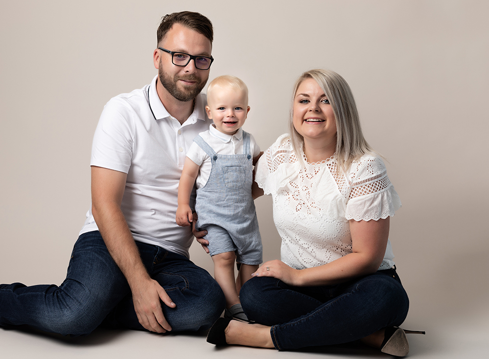 Cake smash alternative ideas - family photograph with parents and toddler in studio