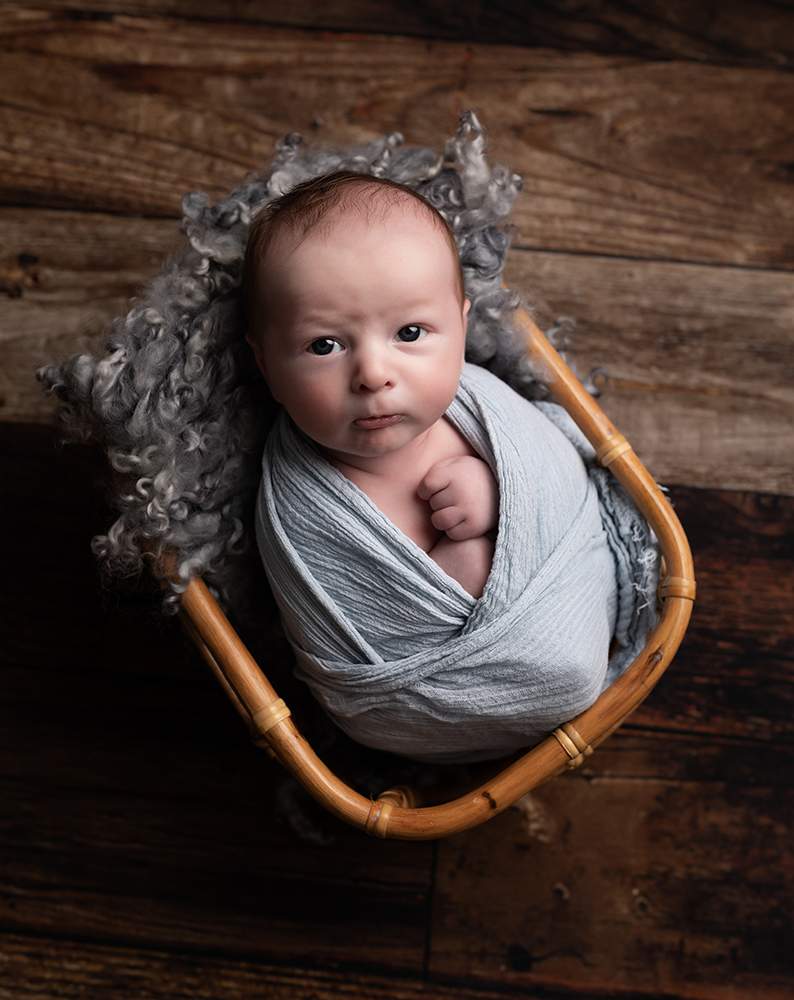 Older newborn baby boy in newborn photoshoot near Milton Keynes