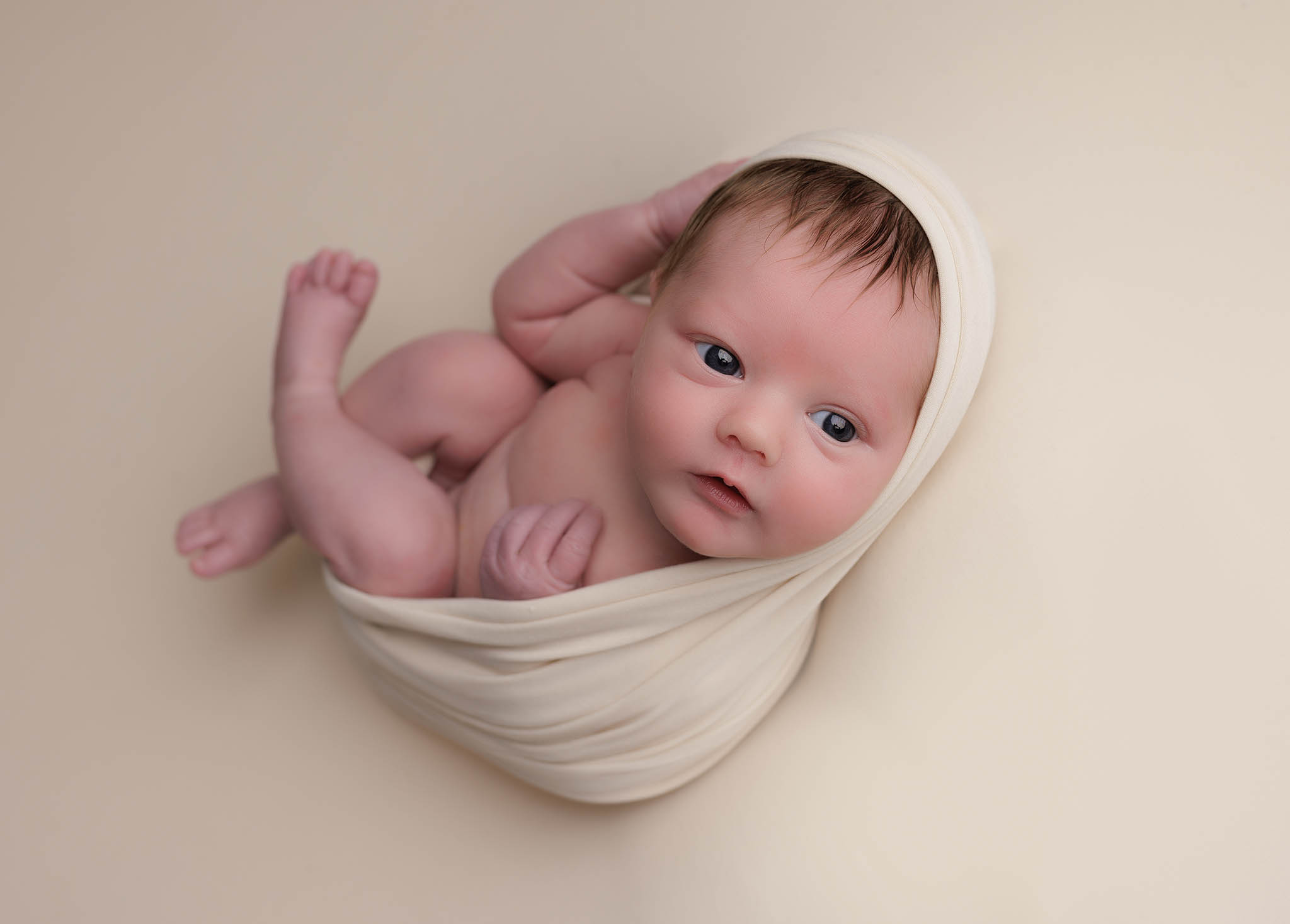 Newborn photographer in Milton Keynes captures image of baby boy with beautiful parents